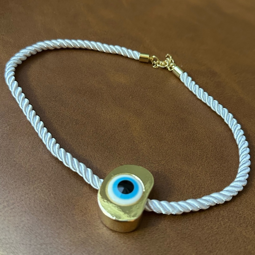 evil eye on gold pendant on white soft rope necklace - Picture 3 of 5